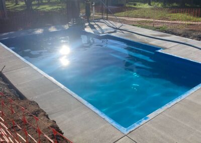 A DIY fibreglass swimming pools installed in a western based Sydney Suburb Cosmo 9 design- colour Pacific blue